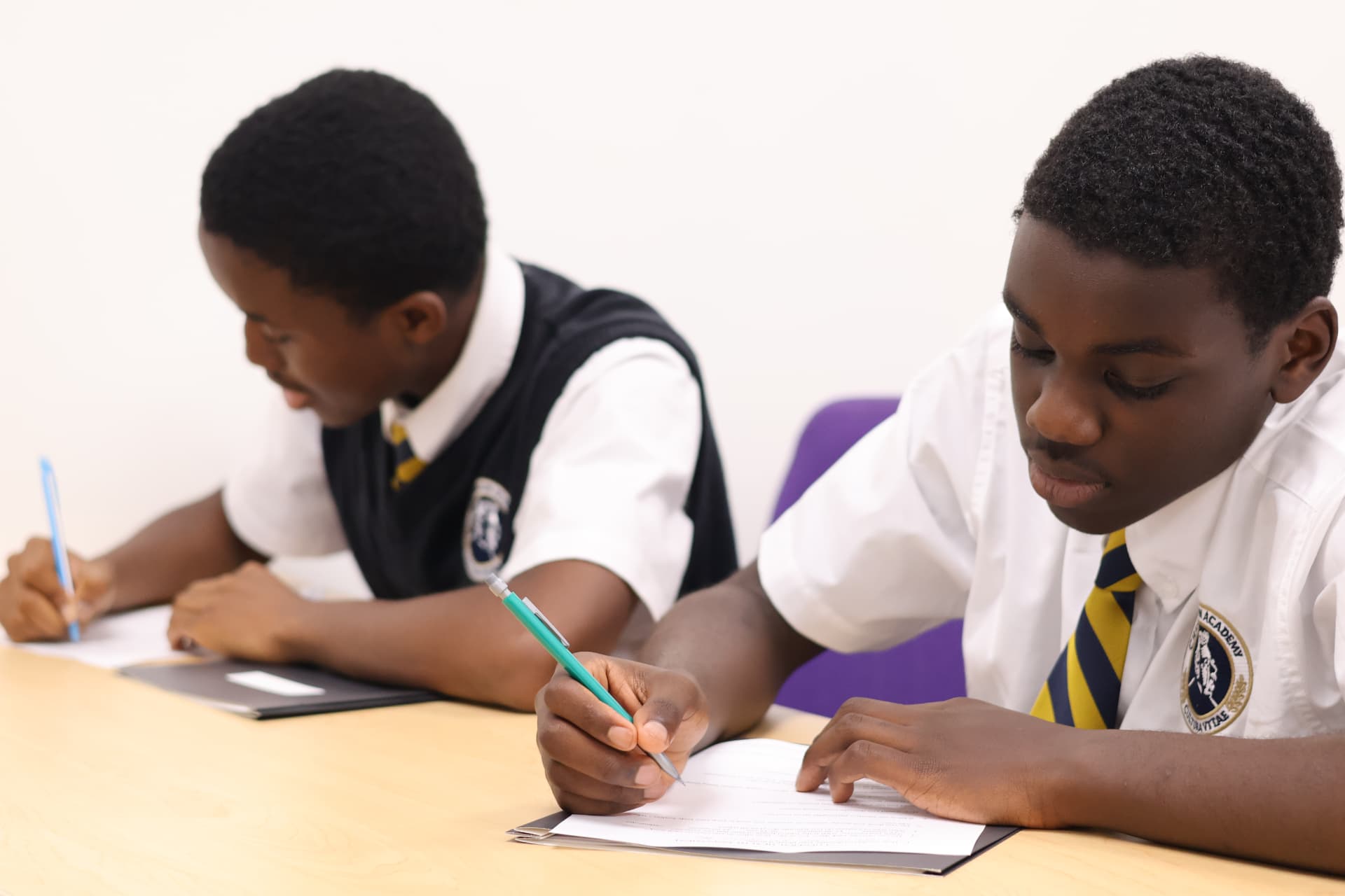 Students working through a lesson together in class